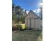 An exterior view of a small storage building with a pair of rustic doors at 170 White Rose Ln, Temple, GA 30179
