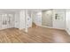 Spacious finished basement area with wood-look flooring, bright lighting, and access to other areas at 2488 Fontainebleau Dr, Dunwoody, GA 30360