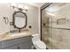 Updated bathroom with a glass-enclosed shower, stylish vanity, and neutral-toned tiles at 2488 Fontainebleau Dr, Dunwoody, GA 30360