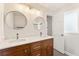 Bathroom featuring double sinks, marble countertops, and wood cabinets at 2488 Fontainebleau Dr, Dunwoody, GA 30360