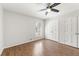 Bright bedroom features hardwood floors, closet and window at 2488 Fontainebleau Dr, Dunwoody, GA 30360
