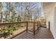 Private deck provides outdoor seating with views of mature trees at 2488 Fontainebleau Dr, Dunwoody, GA 30360