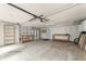Spacious garage with workbench, shelving, and ample room for storage and activities at 2488 Fontainebleau Dr, Dunwoody, GA 30360
