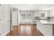 Spacious kitchen with white cabinets, large window, and center island at 2488 Fontainebleau Dr, Dunwoody, GA 30360
