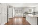 Bright kitchen boasts hardwood floors, granite counters, stainless appliances, and custom cabinets at 2488 Fontainebleau Dr, Dunwoody, GA 30360