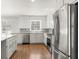 Spacious kitchen features stainless steel appliances, granite countertops and custom cabinets at 2488 Fontainebleau Dr, Dunwoody, GA 30360