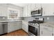 A chef's dream with stainless steel appliances, granite countertops and custom cabinets at 2488 Fontainebleau Dr, Dunwoody, GA 30360