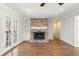Cozy living room featuring fireplace, french doors and hardwood floors at 2488 Fontainebleau Dr, Dunwoody, GA 30360