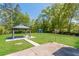 Flat backyard features a gazebo and green lawn at 5702 Forest Dr, Acworth, GA 30102