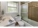 Cozy bathroom with a sink, toilet, and shower-tub combination at 5702 Forest Dr, Acworth, GA 30102