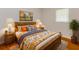 Comfortable bedroom with warm wood accents, hardwood floors and natural light at 5702 Forest Dr, Acworth, GA 30102