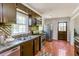 Well-equipped kitchen with stainless steel appliances, and tile backsplash, ready for cooking and entertaining at 5702 Forest Dr, Acworth, GA 30102
