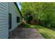 View of the home's backyard and stone patio at 1287 Peninsula Trce, Lawrenceville, GA 30044