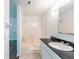 Bathroom featuring a tub and shower, white vanity, and tile floors at 1287 Peninsula Trce, Lawrenceville, GA 30044