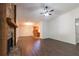 Living room with fireplace, modern floors, and open concept leading to the kitchen at 1287 Peninsula Trce, Lawrenceville, GA 30044