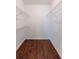 Walk-in closet featuring wood floors and metal shelving at 1287 Peninsula Trce, Lawrenceville, GA 30044
