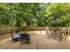 Spacious wooden deck featuring outdoor seating, perfect for entertaining and enjoying the serene backyard at 1875 Fairway Ne Cir, Atlanta, GA 30319