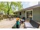 Relaxing back deck with outdoor furniture and green surroundings at 1875 Fairway Ne Cir, Atlanta, GA 30319