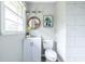 Well-lit bathroom offers a clean design, featuring a white vanity and a tiled shower, perfect for a refreshing start to the day at 1875 Fairway Ne Cir, Atlanta, GA 30319