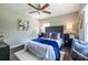 Comfortable bedroom features stylish decor, including a tufted headboard and a cozy throw blanket, creating a relaxing retreat at 1875 Fairway Ne Cir, Atlanta, GA 30319