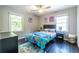 Cozy bedroom features hardwood floors, colorful decor, and plenty of natural light, creating a cheerful and comfortable space at 1875 Fairway Ne Cir, Atlanta, GA 30319