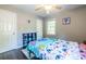 Bright bedroom features hardwood floors and playful decor, offering a cheerful and inviting space for relaxation and rest at 1875 Fairway Ne Cir, Atlanta, GA 30319