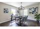 Dining room features hardwood floors, modern lighting, and a bright atmosphere with natural light at 1875 Fairway Ne Cir, Atlanta, GA 30319
