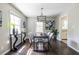 Dining room features hardwood floors, modern lighting, and a bright atmosphere with natural light at 1875 Fairway Ne Cir, Atlanta, GA 30319