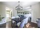 Dining room boasts stylish lighting, hardwood floors, and seamless flow into the kitchen and living room at 1875 Fairway Ne Cir, Atlanta, GA 30319
