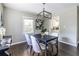 Cozy dining room features modern decor, a dark table and hardwood floors at 1875 Fairway Ne Cir, Atlanta, GA 30319