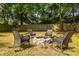 Backyard fire pit with comfortable rocking chairs and natural backdrop at 1875 Fairway Ne Cir, Atlanta, GA 30319