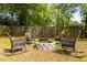 Backyard fire pit area with stone surround and seating at 1875 Fairway Ne Cir, Atlanta, GA 30319