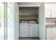 Convenient laundry closet with washer, dryer, and shelving at 1875 Fairway Ne Cir, Atlanta, GA 30319