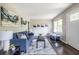 Bright living room with stylish blue sofa, modern decor, and hardwood floors at 1875 Fairway Ne Cir, Atlanta, GA 30319