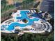 Aerial view of a resort-style pool complex, including a lazy river, slides, and a central fountain at 2022 Boxwood Ln, Canton, GA 30114