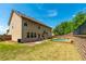 Expansive backyard with a swimming pool, lush lawn, patio, and ample space for outdoor activities at 2022 Boxwood Ln, Canton, GA 30114