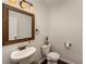 Powder room with modern fixtures and a pedestal sink at 2022 Boxwood Ln, Canton, GA 30114