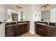 Bathroom with dual sinks, dark wood cabinets, and a separate shower at 2022 Boxwood Ln, Canton, GA 30114