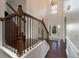 Bright foyer featuring dark hardwood flooring, high ceilings, and a staircase with iron spindles at 2022 Boxwood Ln, Canton, GA 30114