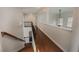 Hallway overlooking staircase with wood floors and railing at 2022 Boxwood Ln, Canton, GA 30114