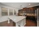 Kitchen with large island with a quartz countertop, and stainless steel appliances at 2022 Boxwood Ln, Canton, GA 30114