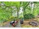 Enjoy the beautiful view on the back deck, complete with seating and a fire pit at 3160 Bailey Cove Ct, Dacula, GA 30019
