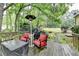 Relax on the back deck with comfortable seating, a grill, and picturesque views at 3160 Bailey Cove Ct, Dacula, GA 30019