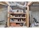 Unfinished basement storage area with shelving. Great storage for tools and seasonal items at 3160 Bailey Cove Ct, Dacula, GA 30019