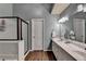 Modern bathroom featuring double sinks, a sleek shower, and neutral tones, perfect for a relaxing retreat at 3160 Bailey Cove Ct, Dacula, GA 30019