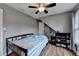 Neutral bedroom with hardwood floors, good ceiling fan, and unique sloped ceiling at 3160 Bailey Cove Ct, Dacula, GA 30019