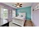 Charming bedroom with purple and teal walls, carpet, and a white wood bed at 3160 Bailey Cove Ct, Dacula, GA 30019