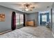 Bedroom with ample natural light, neutral carpet, and ceiling fan at 3160 Bailey Cove Ct, Dacula, GA 30019