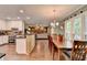 Open concept, with dining area adjacent to updated kitchen at 3160 Bailey Cove Ct, Dacula, GA 30019
