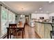 Open concept kitchen and dining area with lots of windows at 3160 Bailey Cove Ct, Dacula, GA 30019